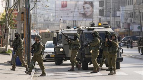 Suspected Palestinian shooting attack kills 2 Israelis in West Bank, Israeli military says
